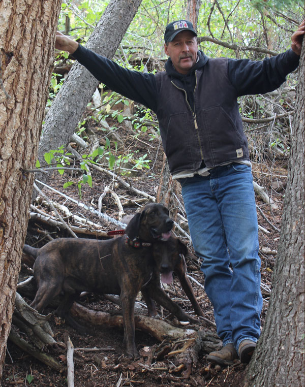 Bob Olson with Plott hounds